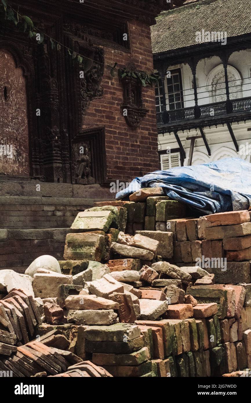 Bricks laid in stacks outside the former royal palace at kathmandu durbar square in an effort to rebuild after the 2015 earthquake. Stock Photo