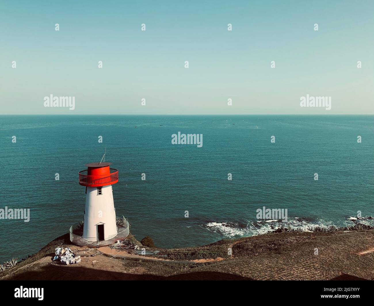 An aerial view of red and white lighthouse on a sea cliff Stock Photo ...