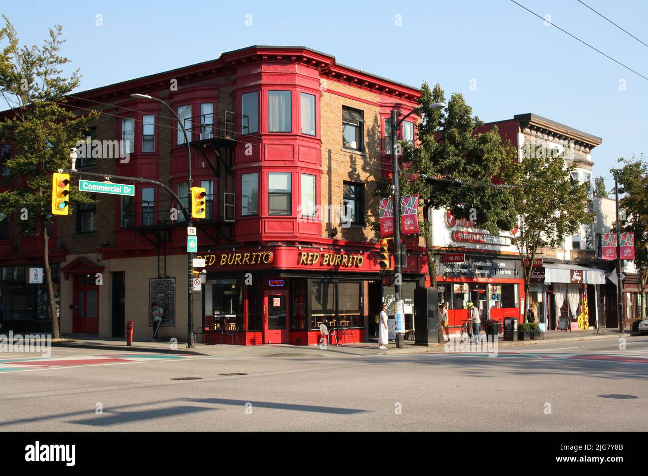 a Crossroad and red-painted heritage building in East Vancouver, British Columbia, Canada Stock Photo