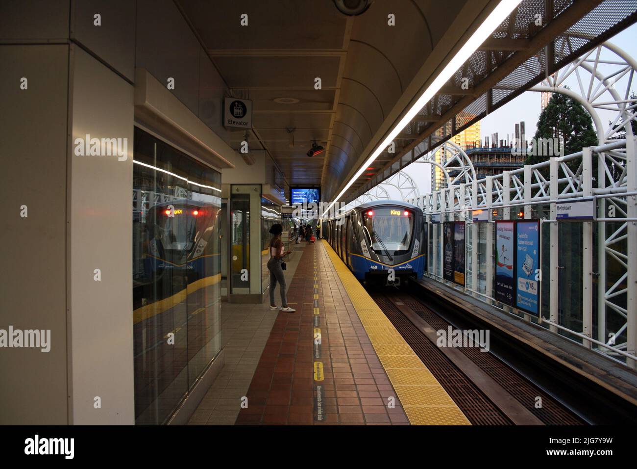 a SkyTrain leaving Paterson station in Burnaby, British Columbia ...