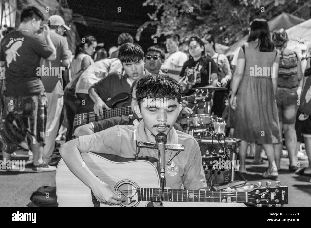 A street musician band composed of blind members in the night market