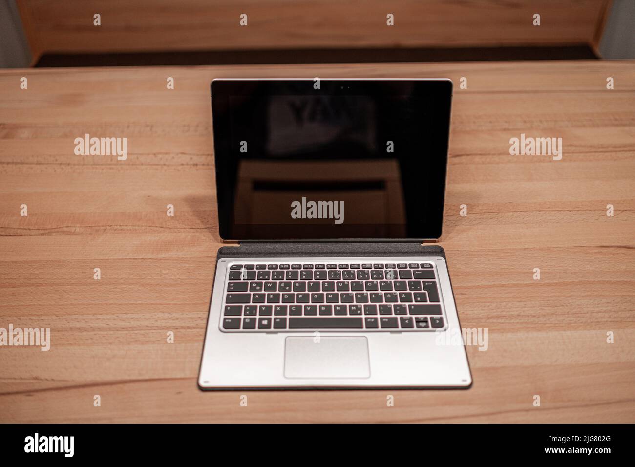 Tablet PC Convertible Laptop on a Wooden Table in Bavaria Germany Stock Photo