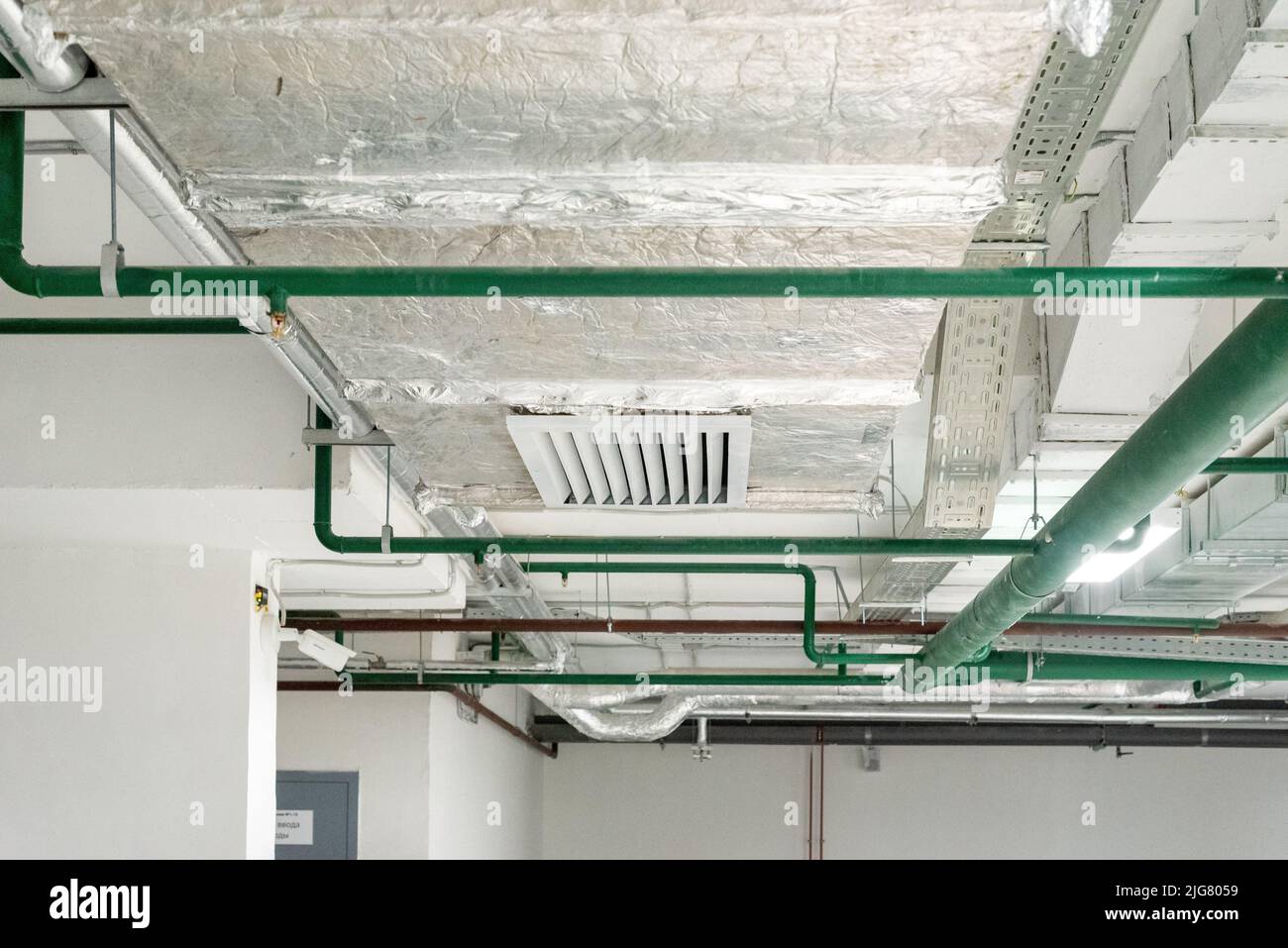 Pipes, ventilation and air conditioning in the underground garage. New