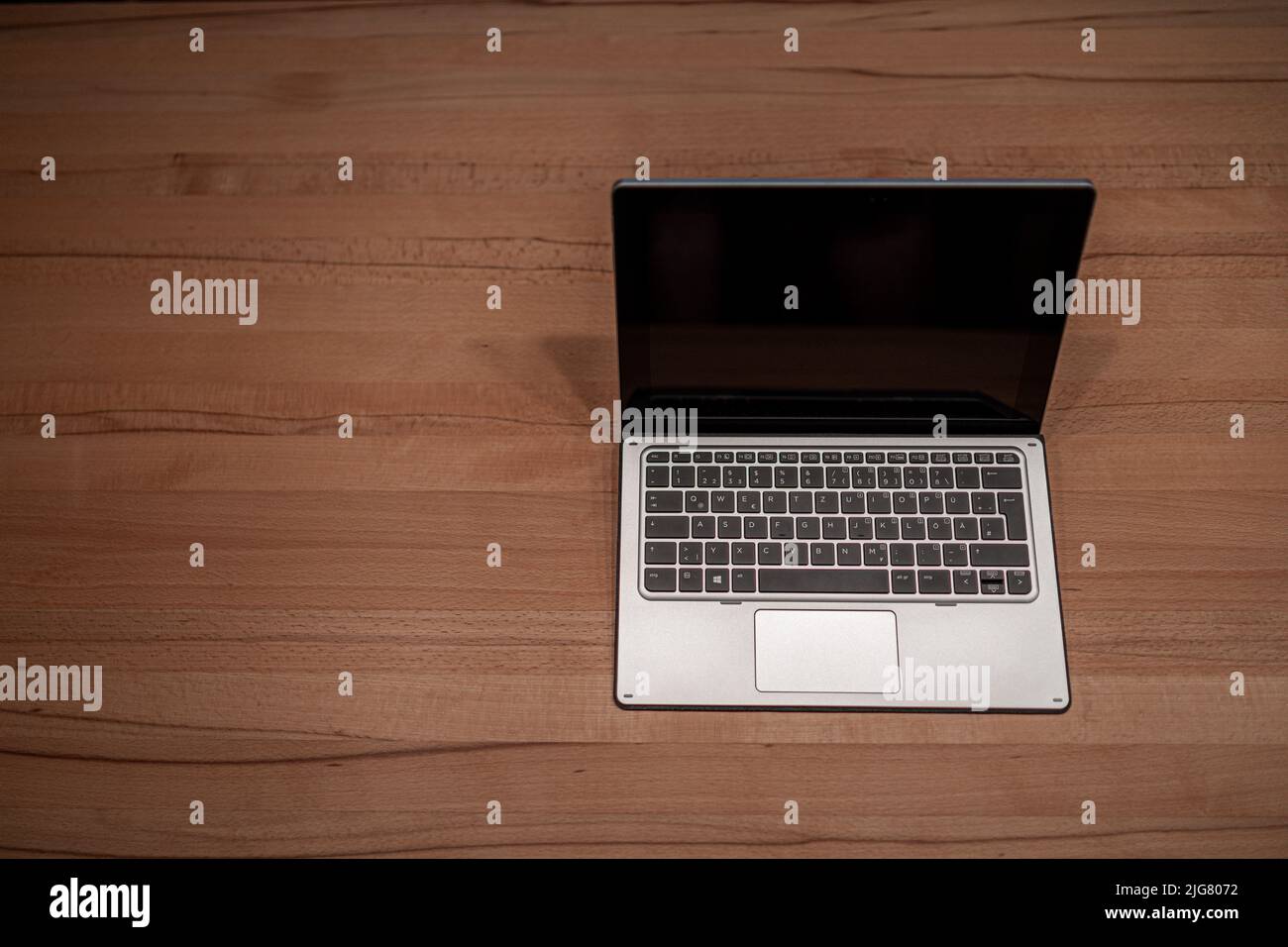 Tablet PC Convertible Laptop on a Wooden Table in Bavaria Germany Stock Photo