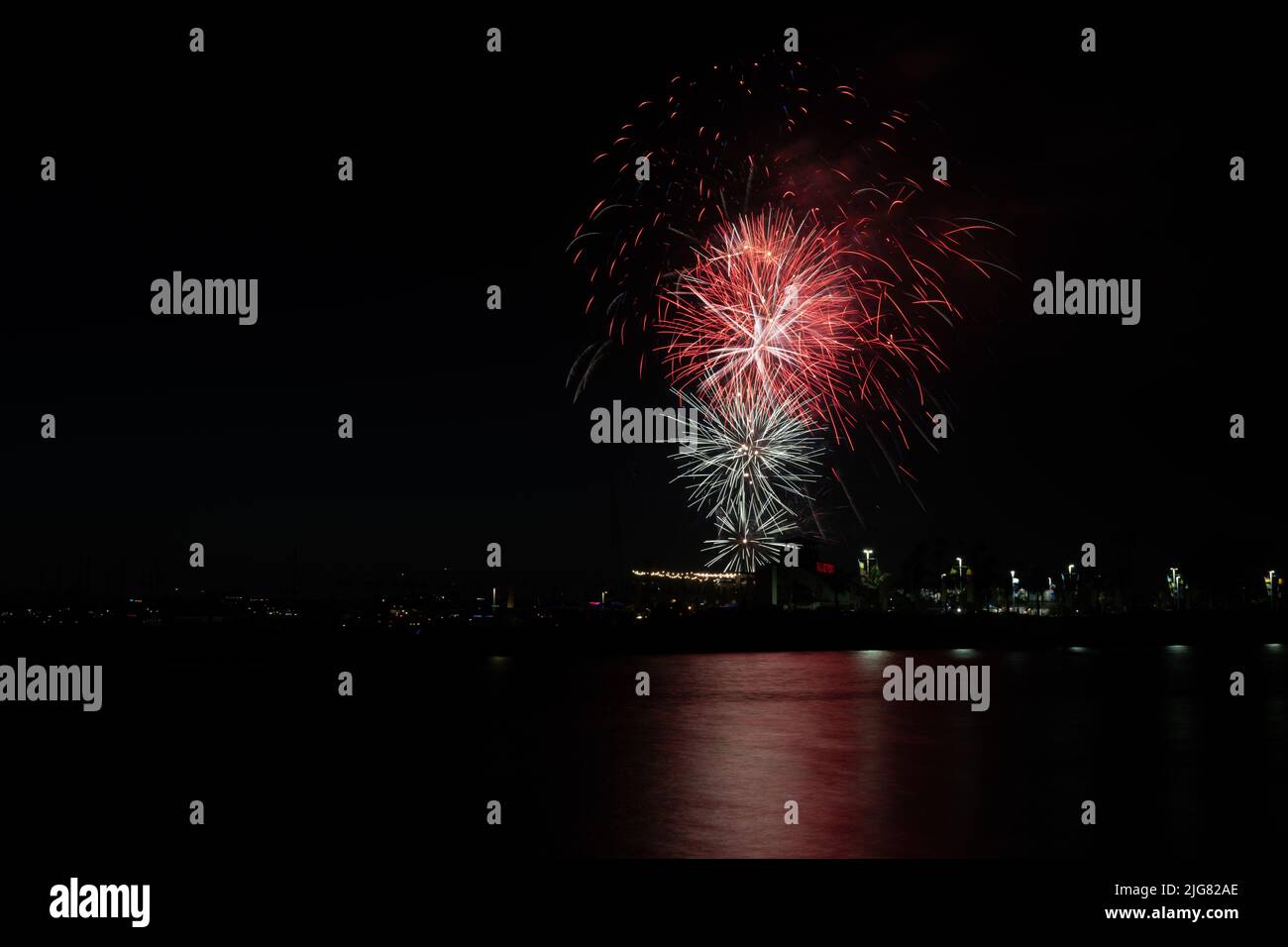 Fireworks shoot over water of Alamitos Bay in Long Beach for July 4th