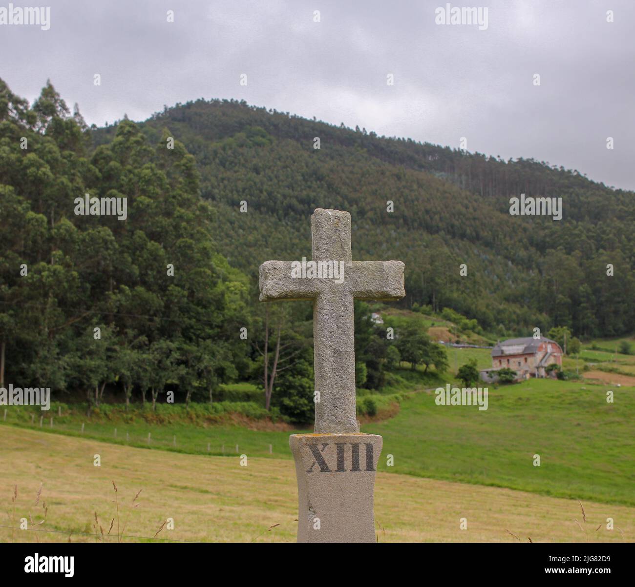christian cross by the side of the road to the mountains Stock Photo Alamy