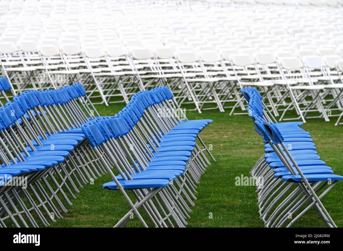 White and blue rows of chairs in the garden of the United States Capitol on the National Mall