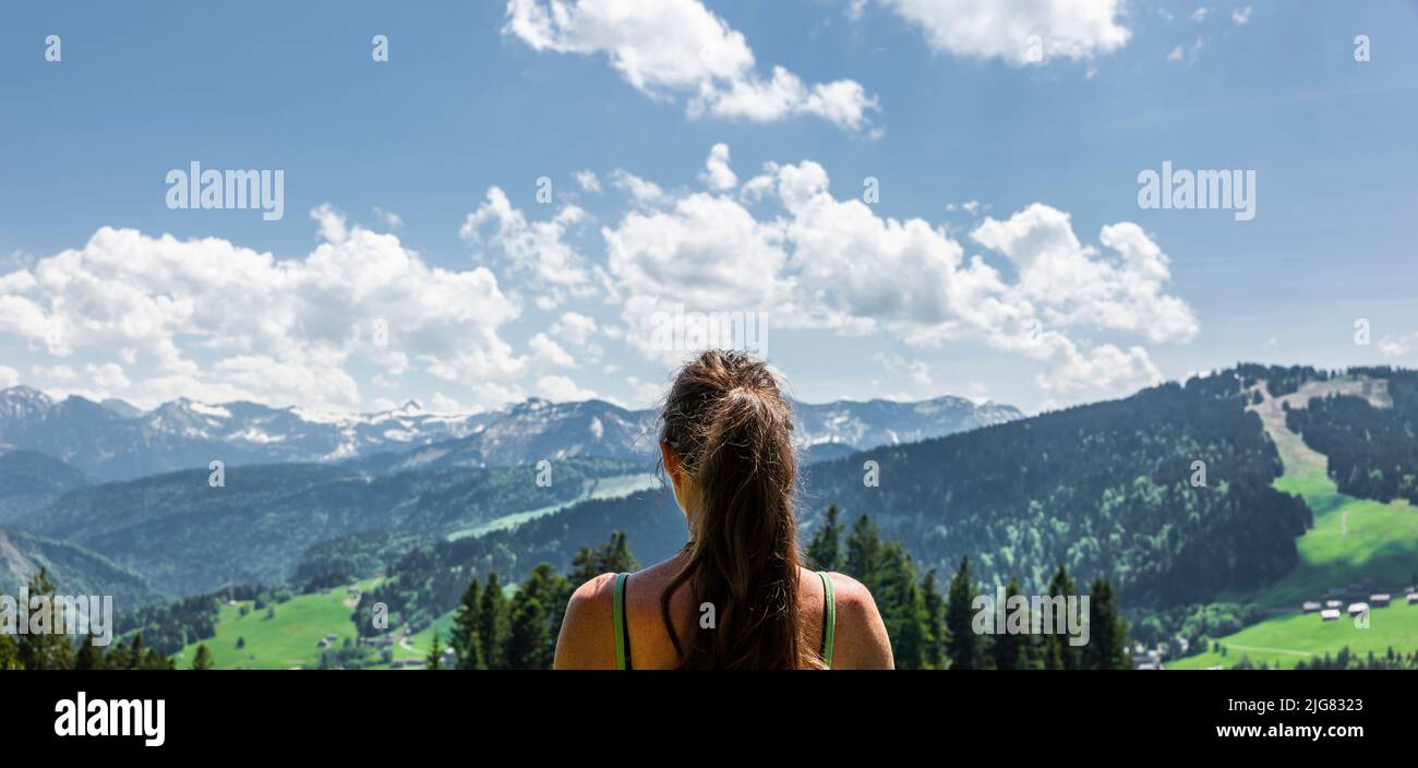 Woman hiking in the Bregenz Forest in Vorarlberg Stock Photo