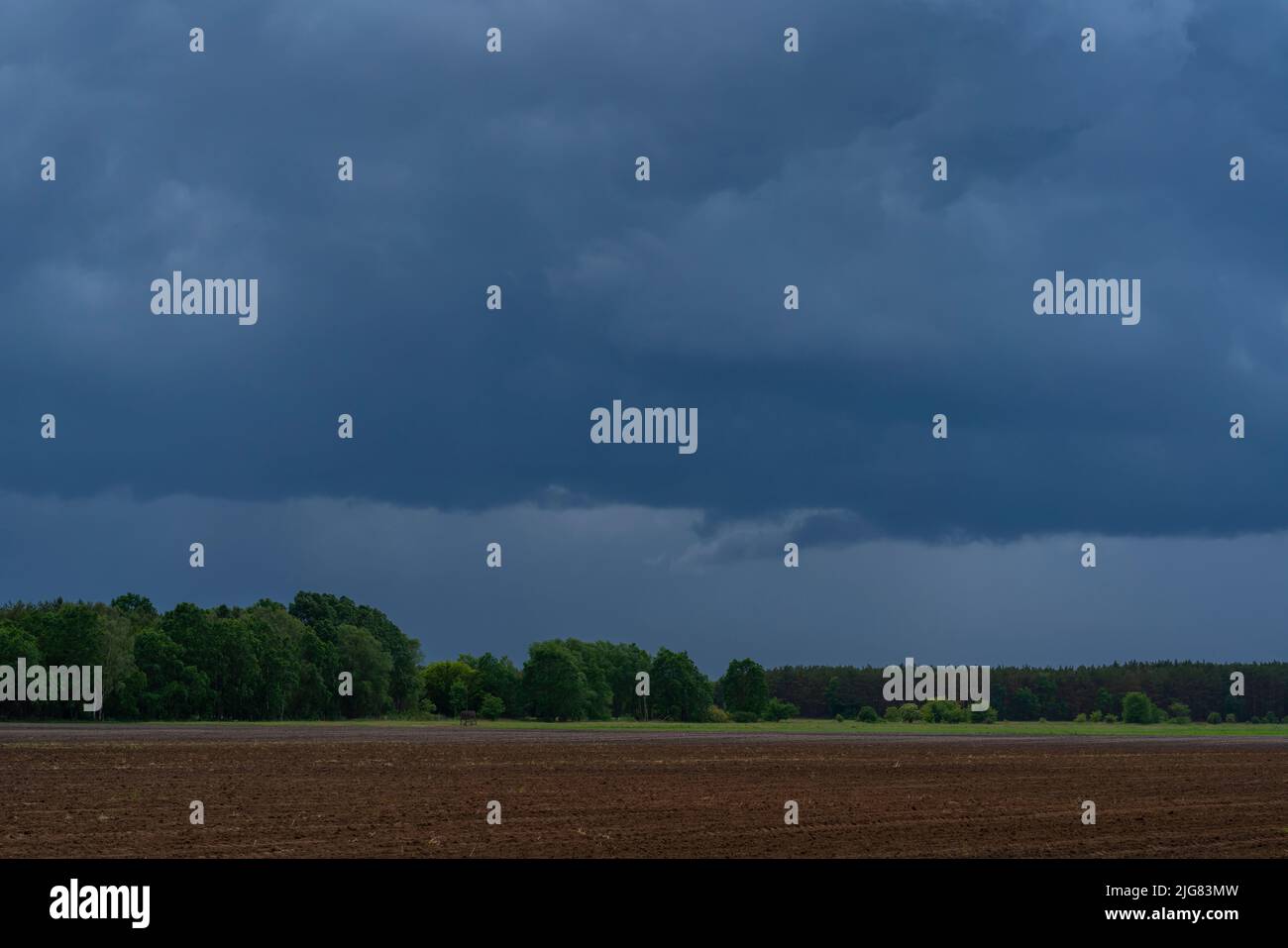 Large rain clouds over an agricultural area just before a bad storm Stock Photo