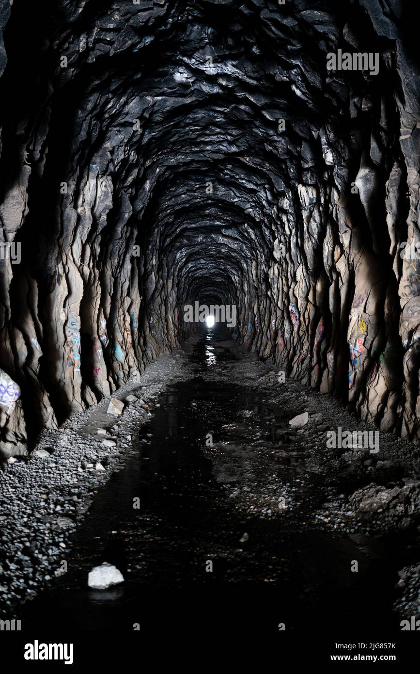 A vertical shot of the inside the Donner Summit China Wall tunnel with ...