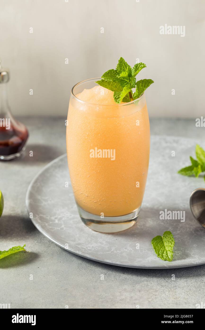 Boozy Frozen Rum Planters Punch with Lime and Mint Stock Photo Alamy