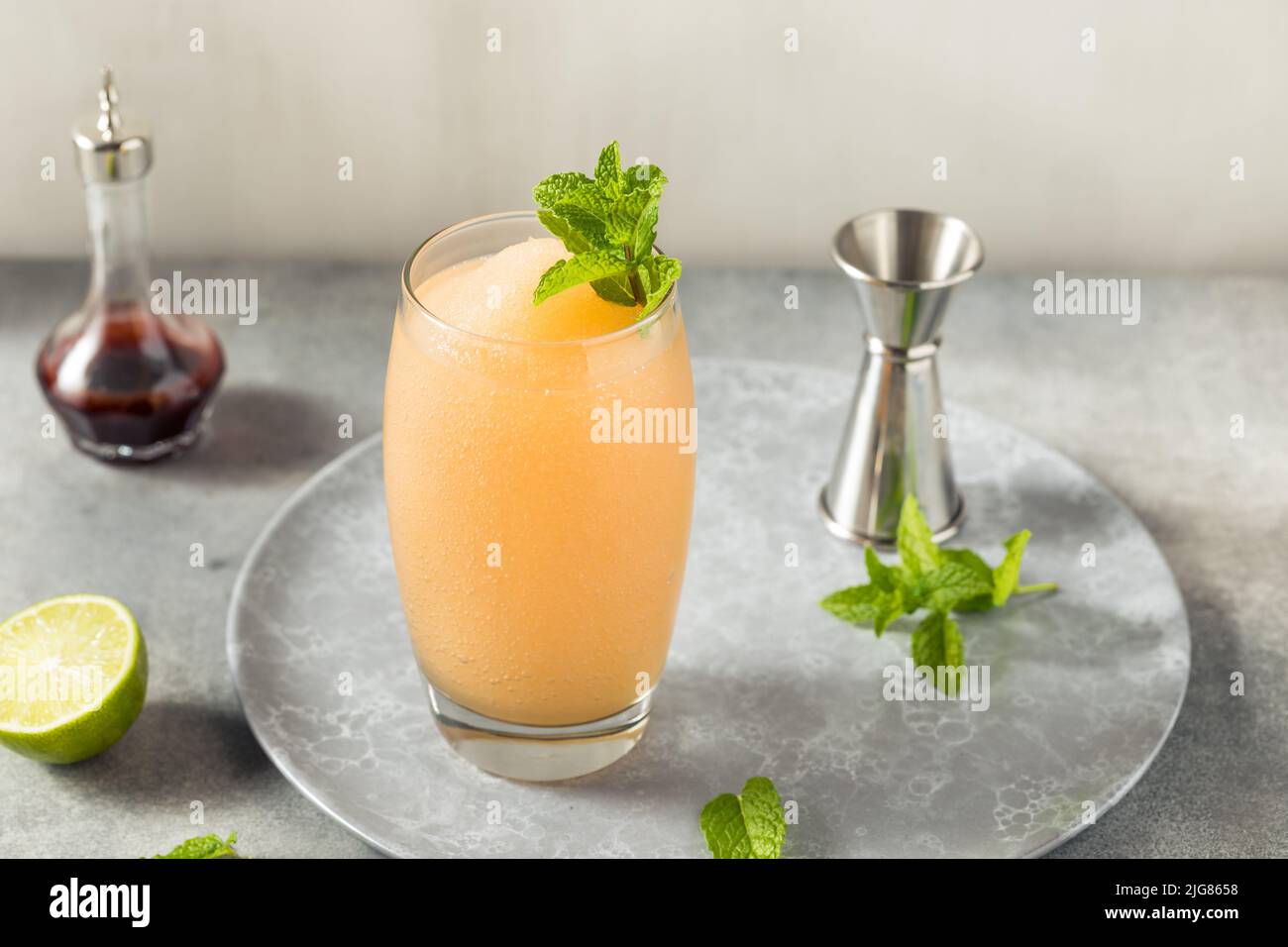 Boozy Frozen Rum Planters Punch with Lime and Mint Stock Photo Alamy