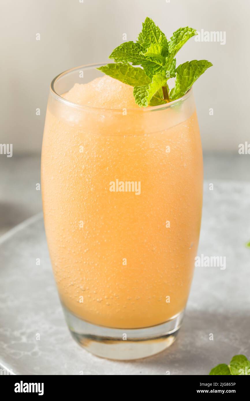 Boozy Frozen Rum Planters Punch with Lime and Mint Stock Photo