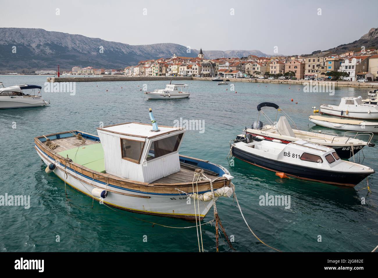 Boats in Baska harbor, Adriatic coast, Krk island, Kvarner bay, Primorje-Gorski kotar county, Croatia, Europe Stock Photo