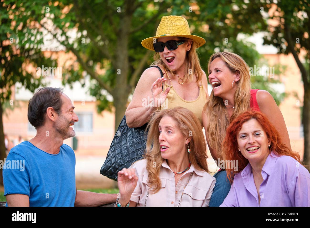 Five mature adults having fun in a park. Stock Photo