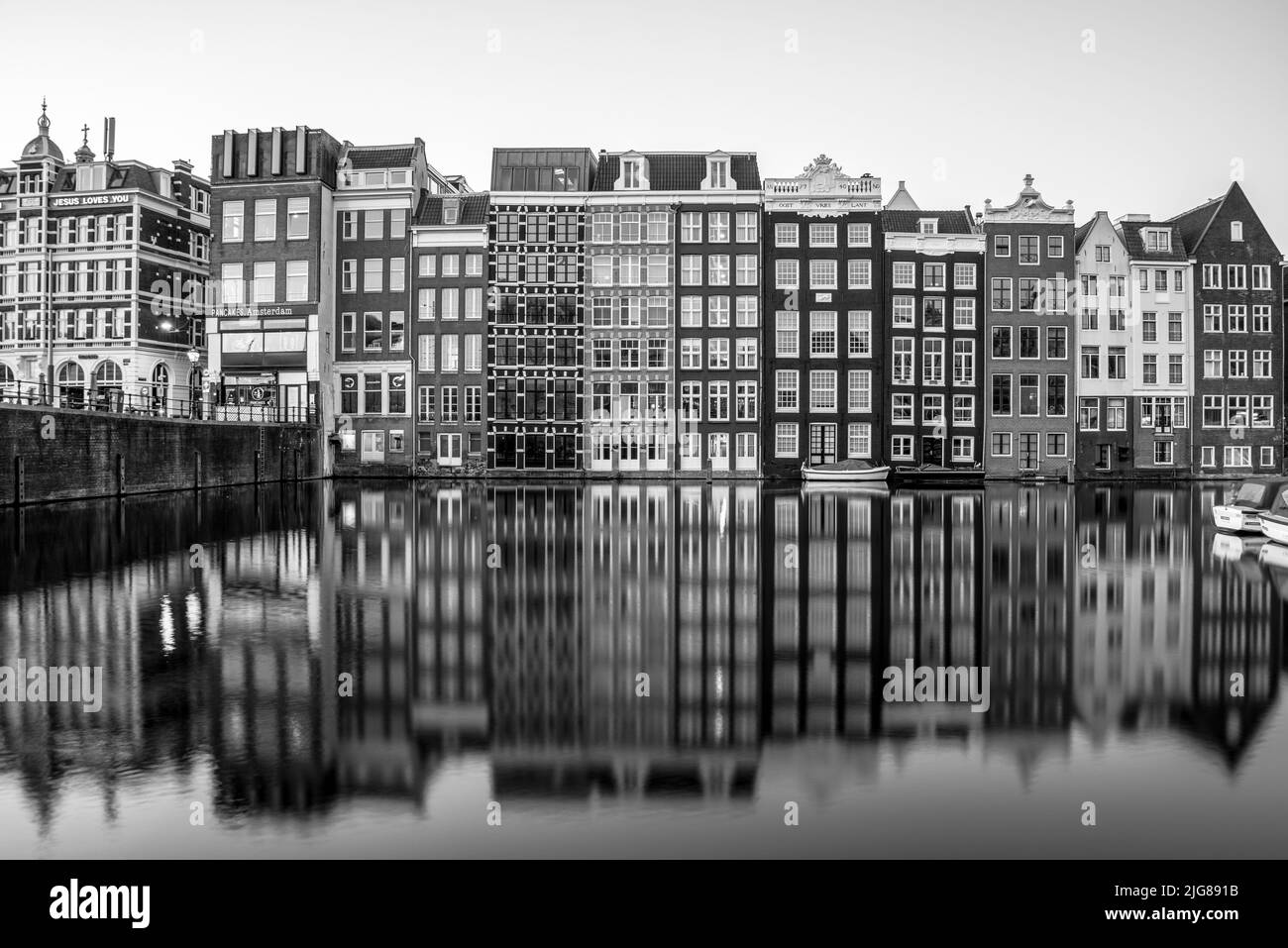 Characteristic houses, Damrak canal, Amsterdam, Netherlands Stock Photo