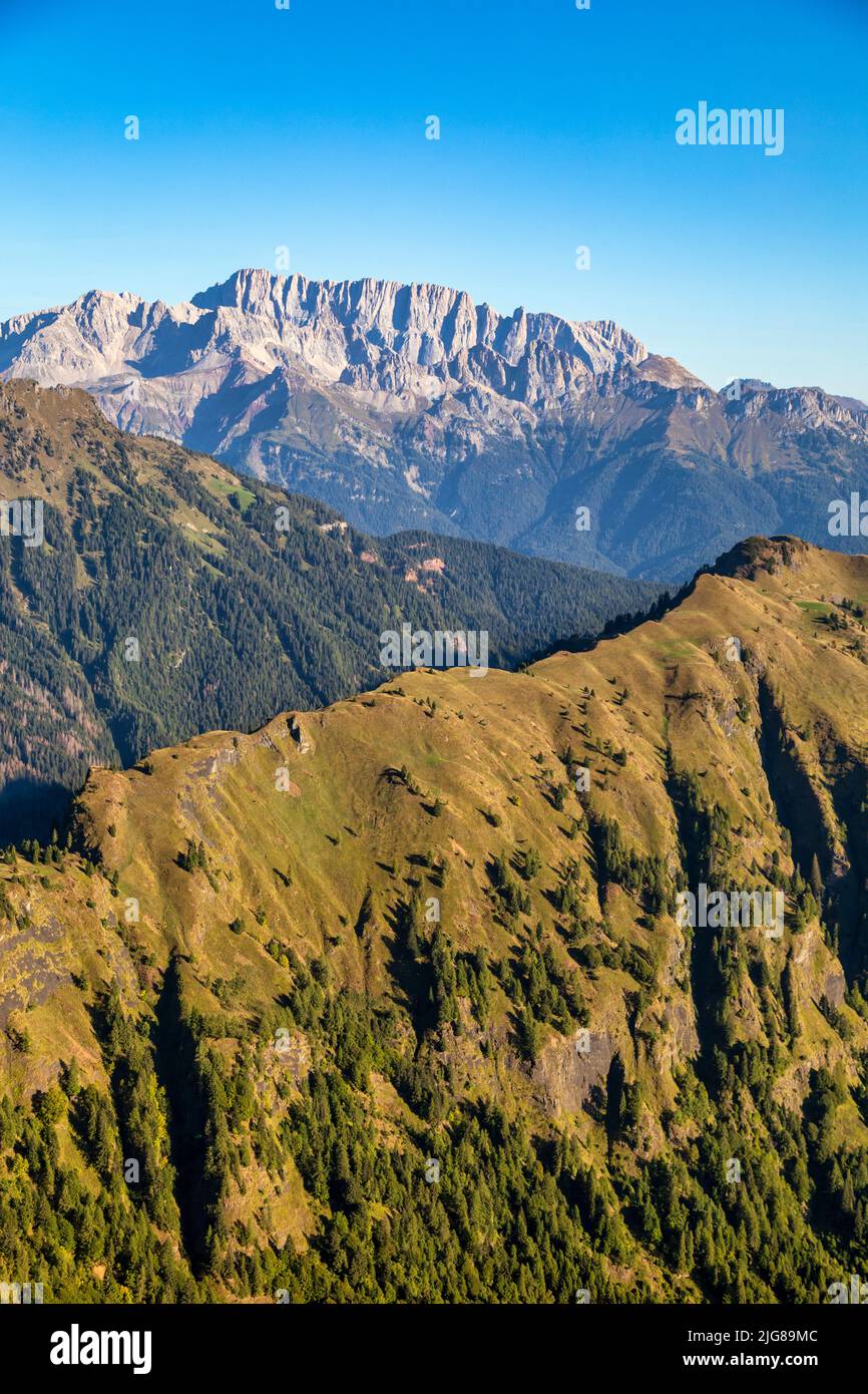 Italy, Veneto, Belluno, Canale d'Agordo, morning view of the green ridge of Palalada, on the background the siuth side of Marmolada Stock Photo