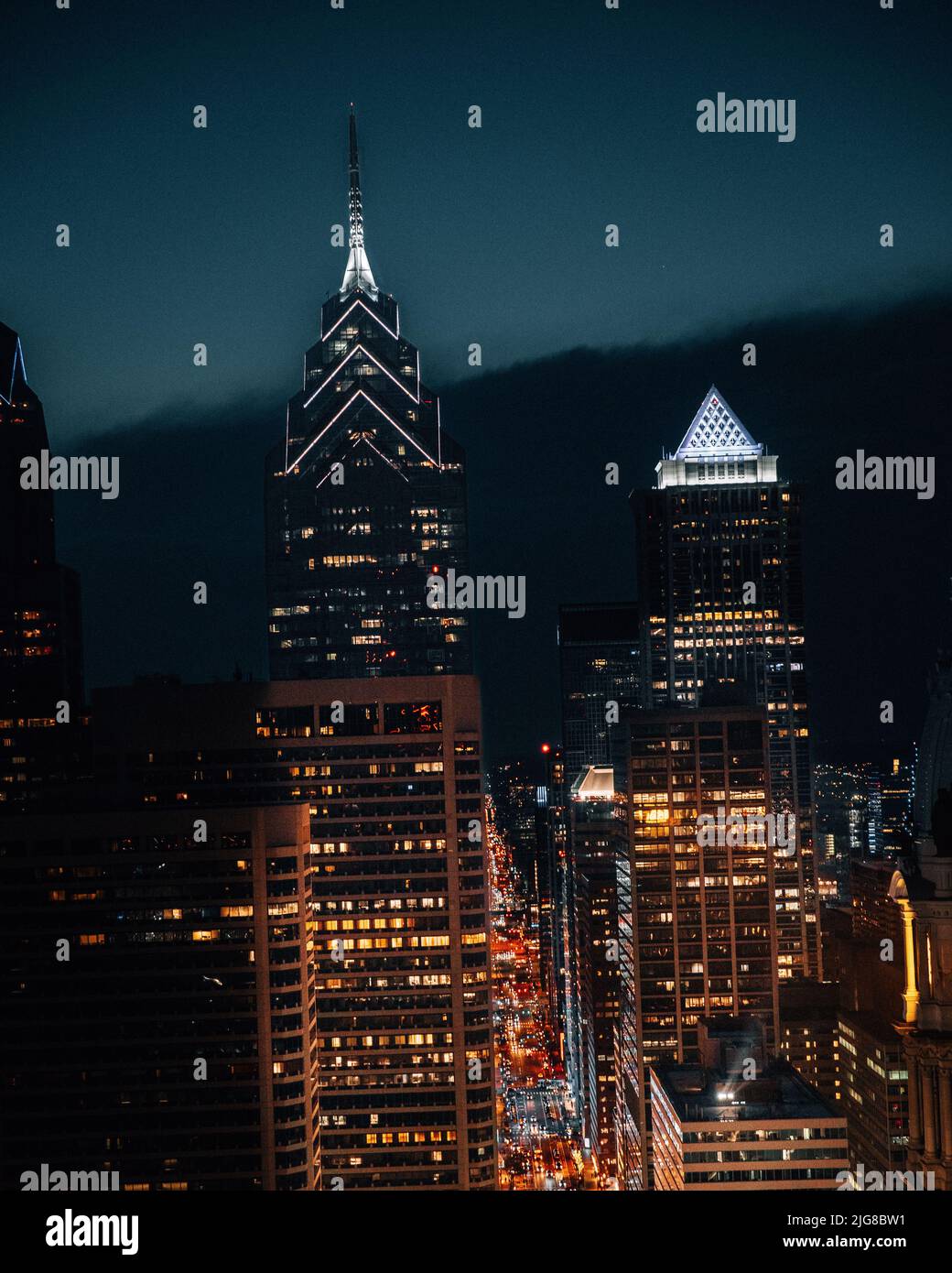 A vertical shot of the New York City skyline in the nighttime Stock ...