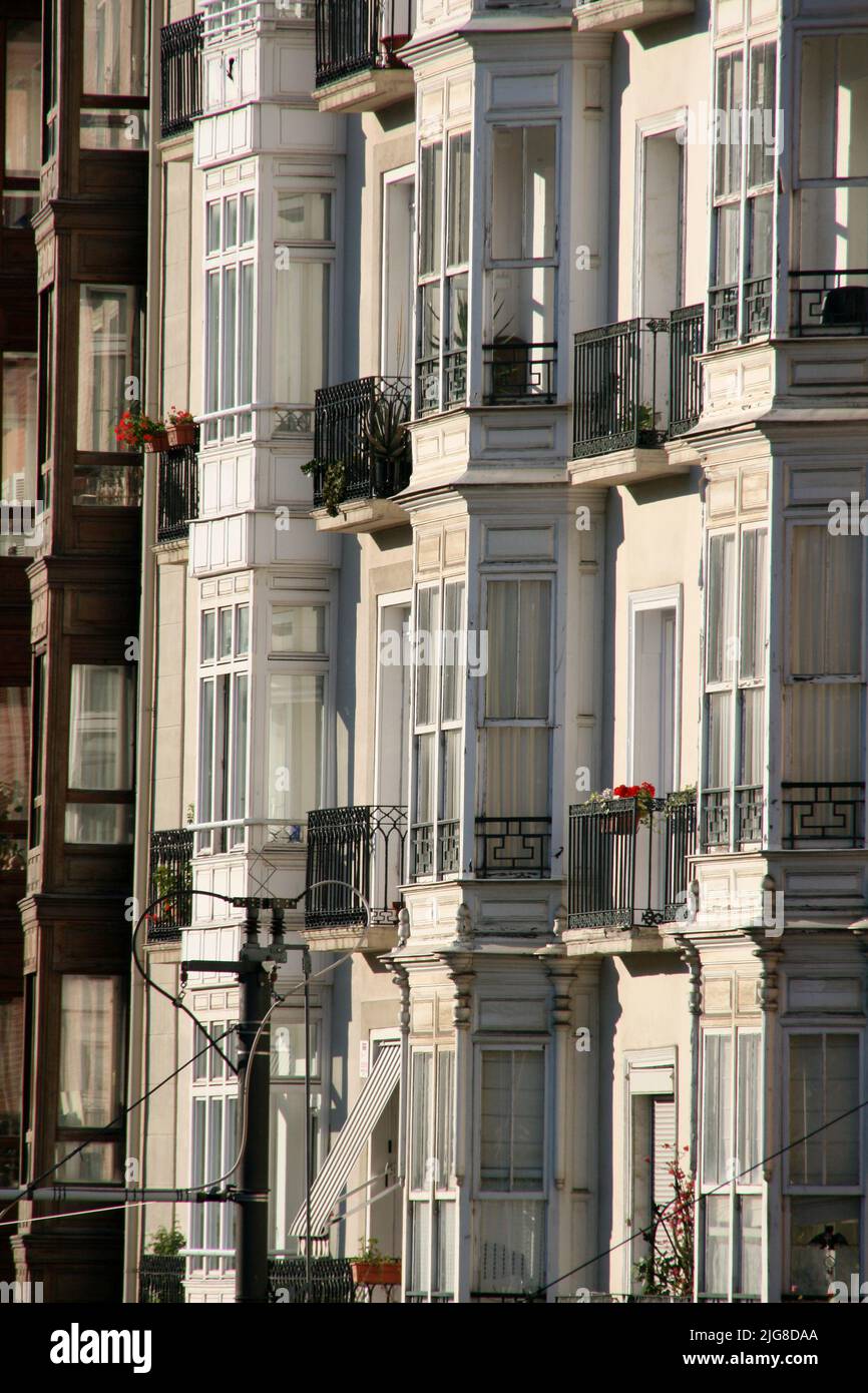 A vertical shot of an old apartment building facade in Bilbao, Spain ...