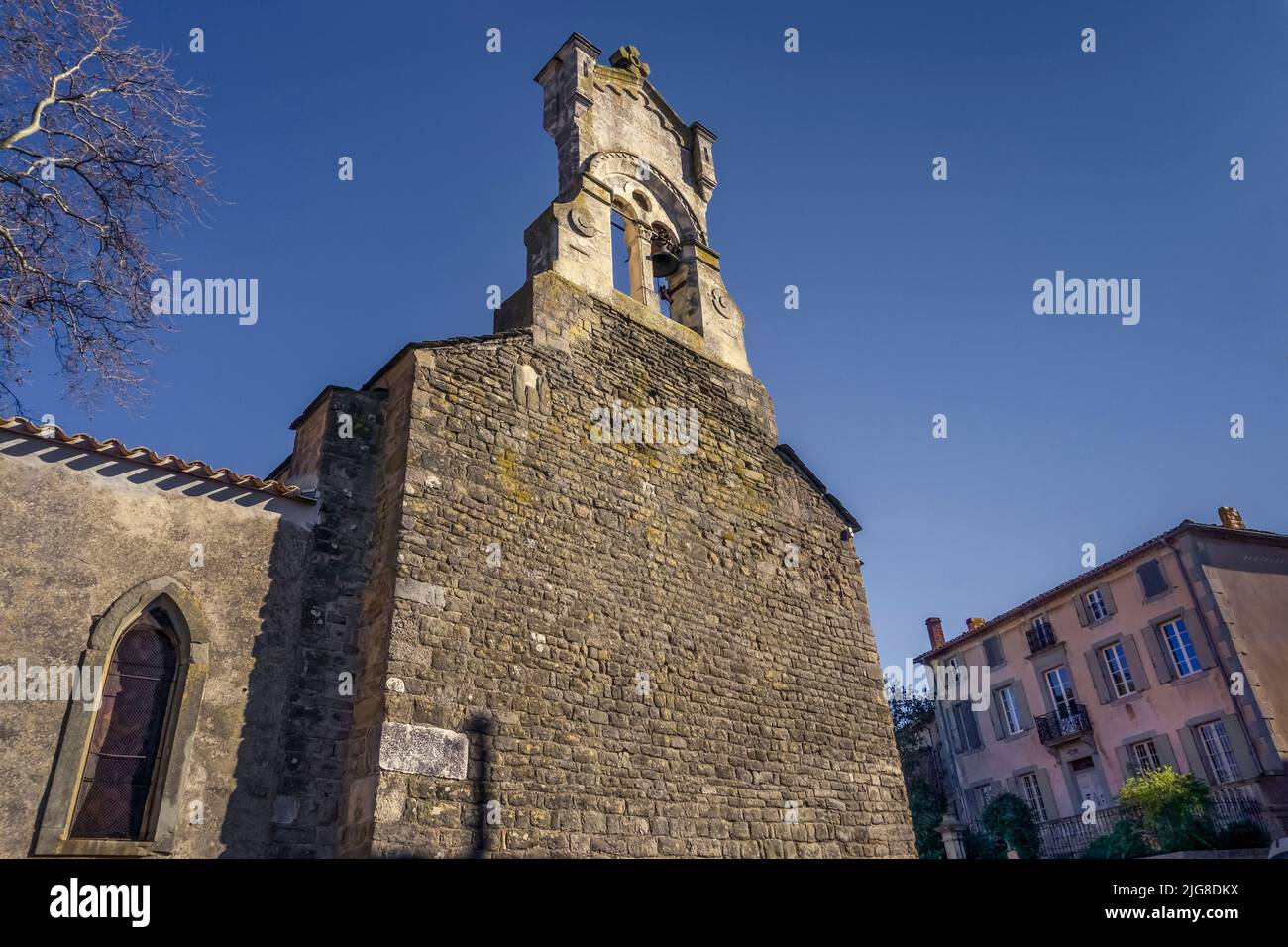 Bell tower of the parish church of Saint Cucufat in Saint Couat d'Aude. Built in the XII century in Romanesque style. Monument Historique. Stock Photo