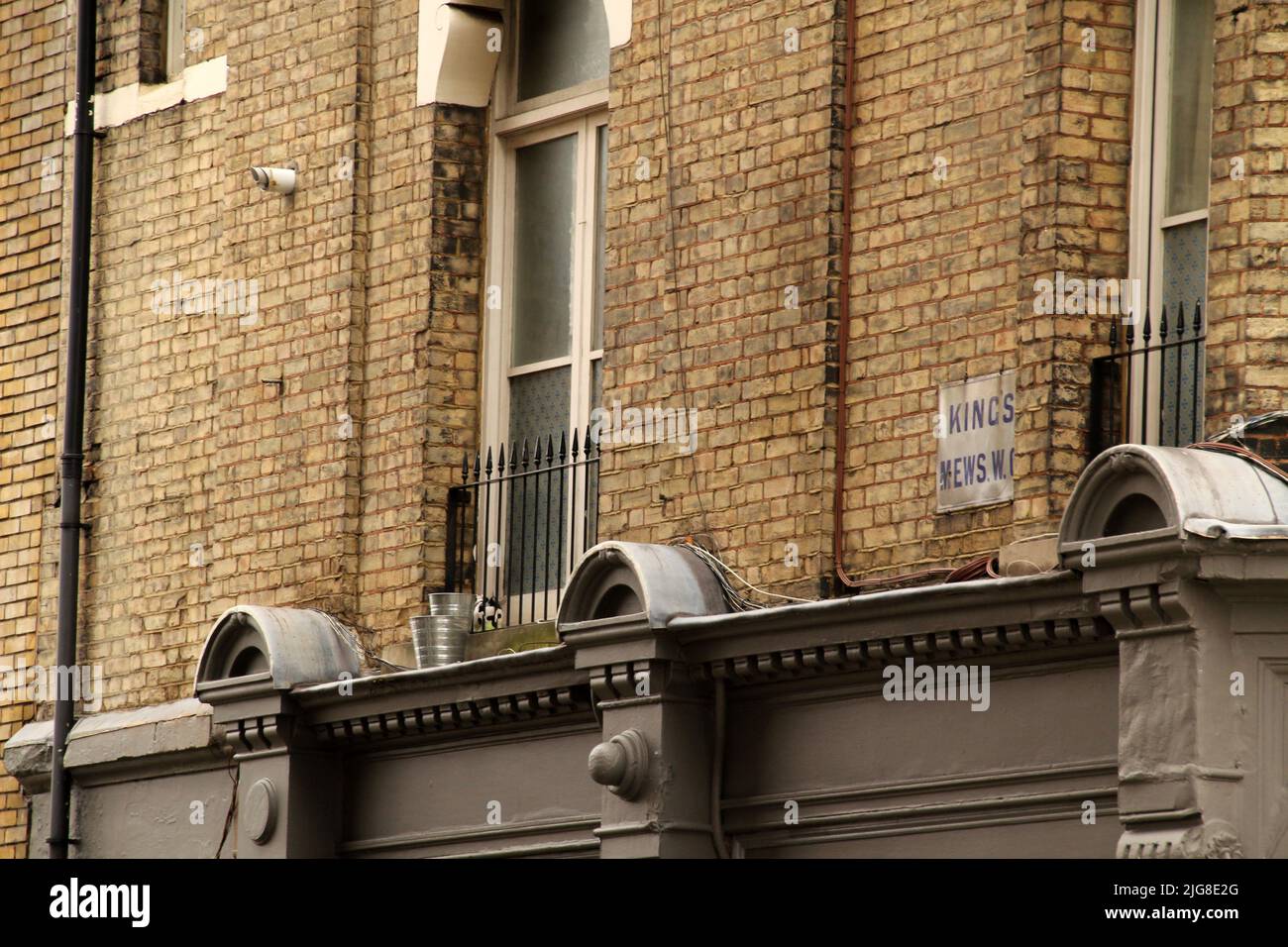 The view of a part of the city building facade walls vintage exterior
