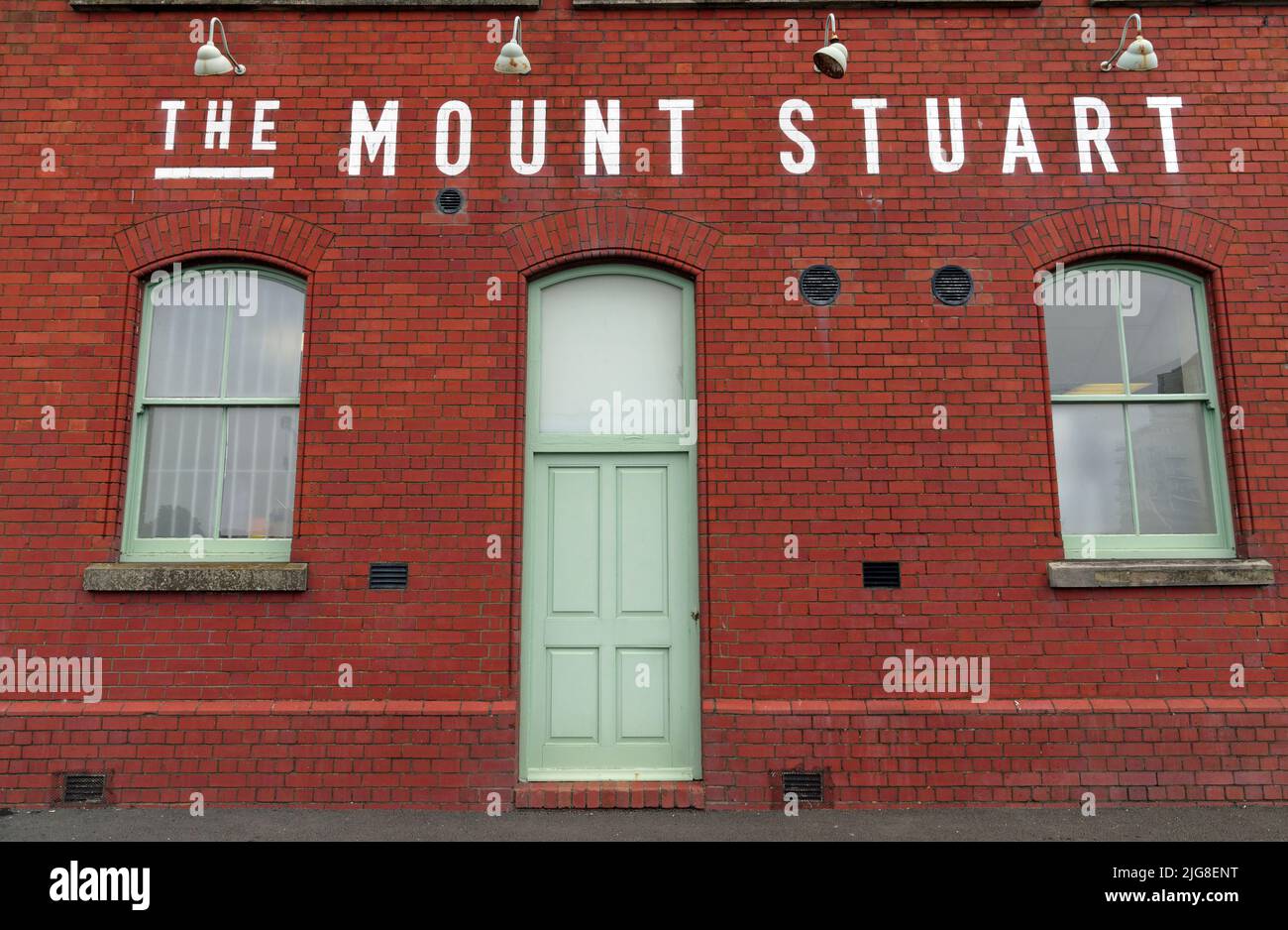 The Mount Stuart (side door view), red brick façade, Cardiff Bay. July 2022. Summer. Stock Photo