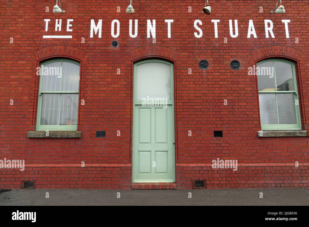 The Mount Stuart (side door view), red brick façade, Cardiff Bay. July 2022. Summer. Stock Photo