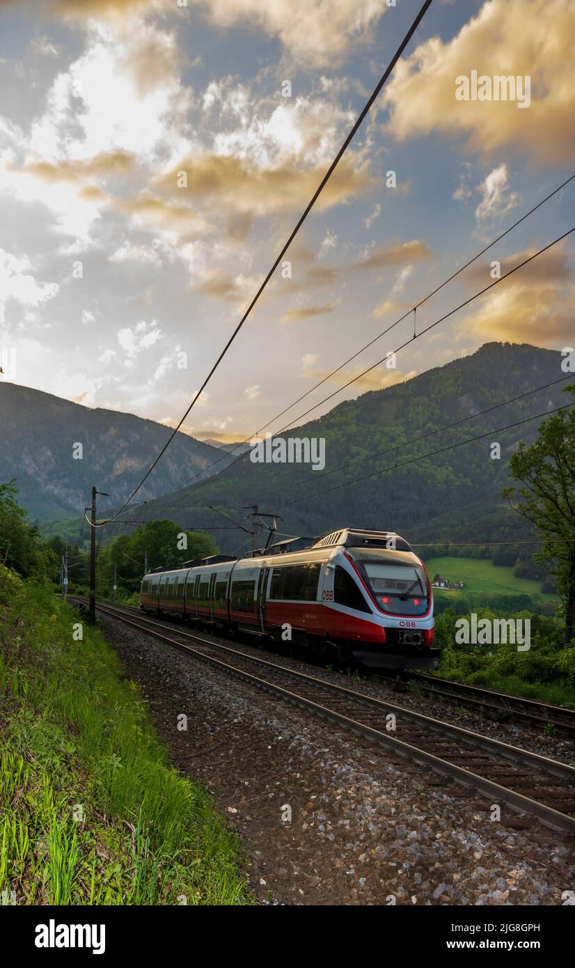 Payerbach, Semmeringbahn (Semmering Railway), tracks nearby Küb, local train of ÖBB, sunset, view to mountain Saurüssel in the Vienna Alps, Lower Austria, Austria Stock Photo