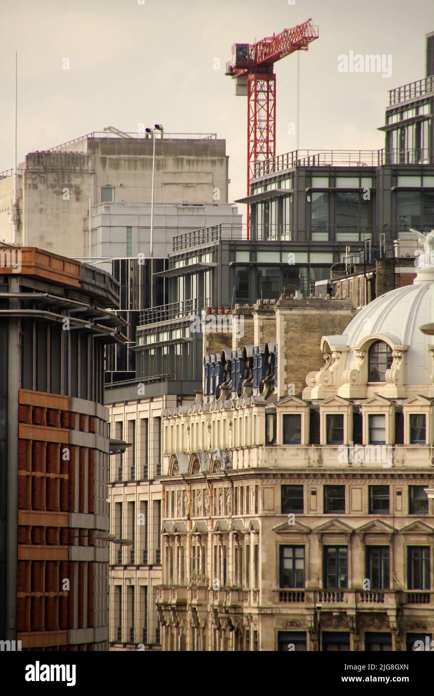 A vertical shot of constructing buildings in London Stock Photo