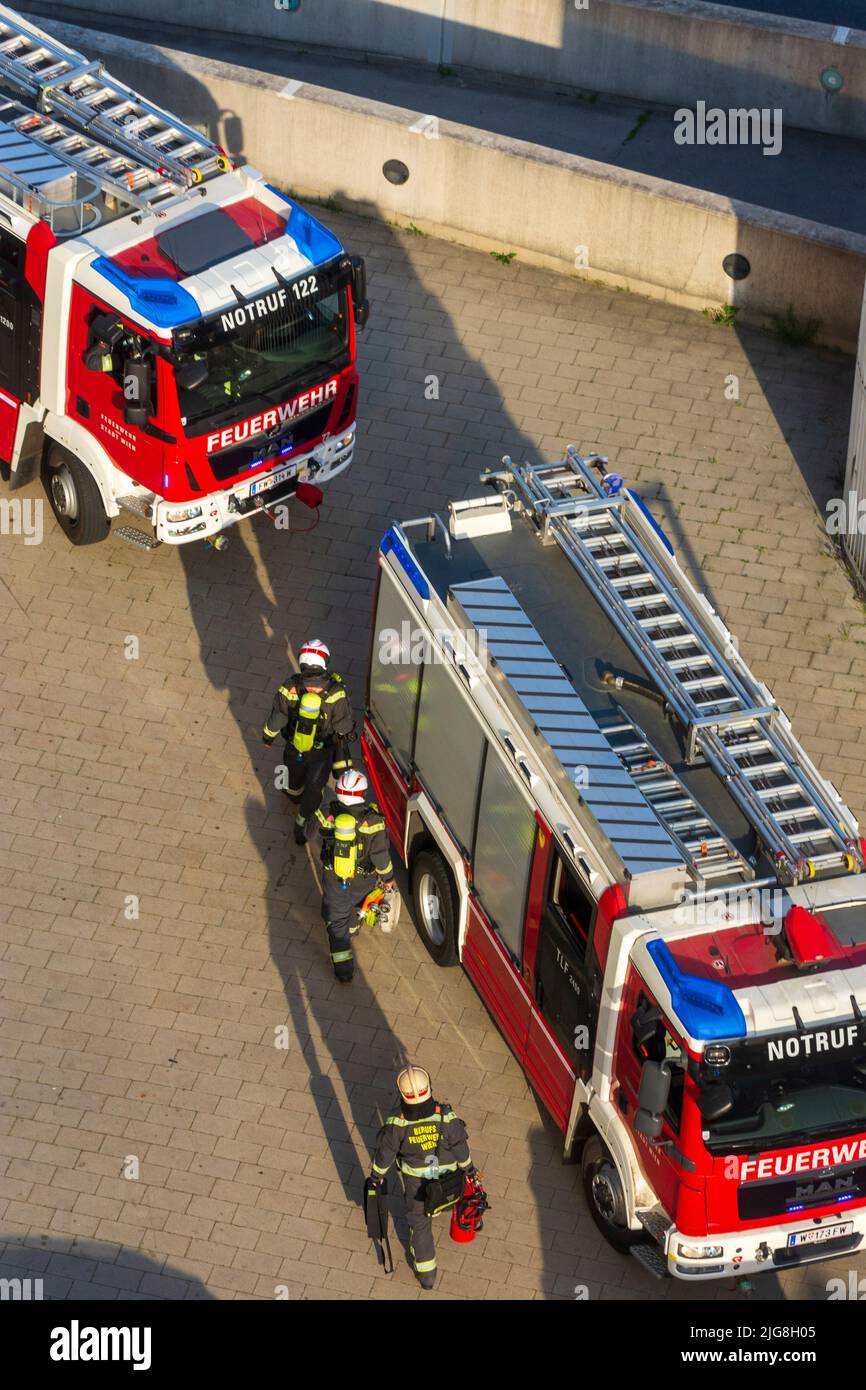 Vienna, fire department trucks, firemen on the way back from a fire in 22. district Donaustadt, Wien, Austria Stock Photo