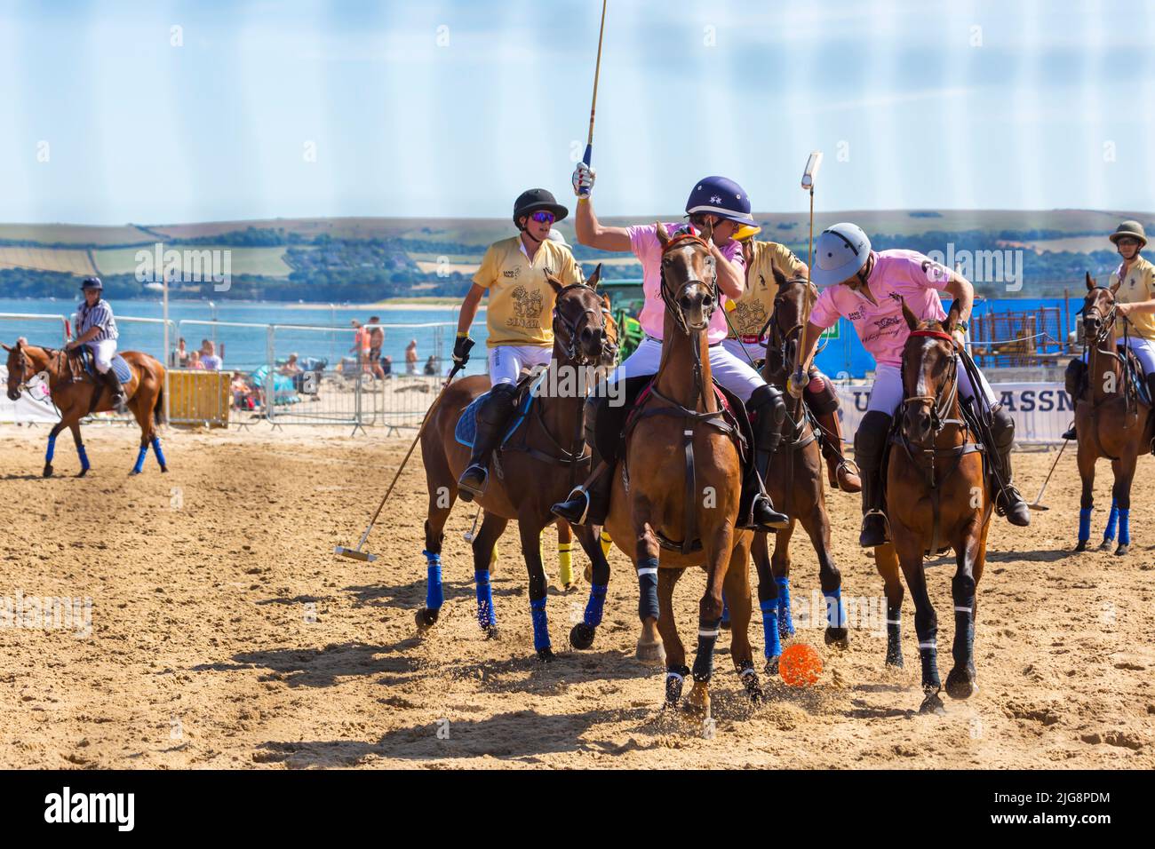 Sandbanks, Poole, Dorset, UK . 8th July 2022. The Sandpolo British Beach Polo Championships gets underway at Sandbanks beach, Poole on a hot sunny day. Celebrating its 15th anniversary the largest beach polo event in the world, the two day event takes place on Friday and Saturday, as visitors head to the beach to see the action. Credit: Carolyn Jenkins/Alamy Live News Stock Photo