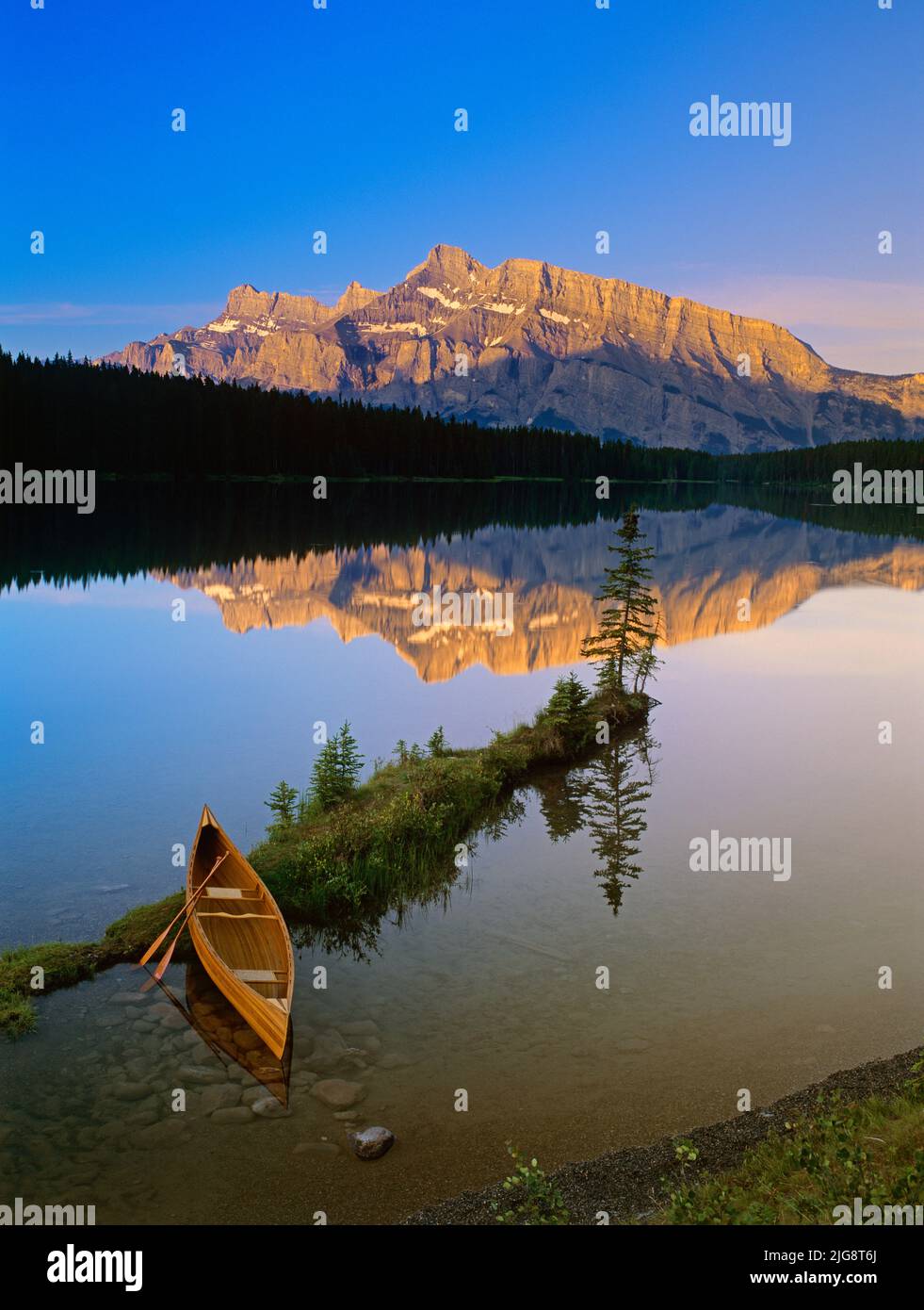 Canoe at Two Jack Lake at Sunrise, Banff National Park, Alberta, Canada Stock Photo