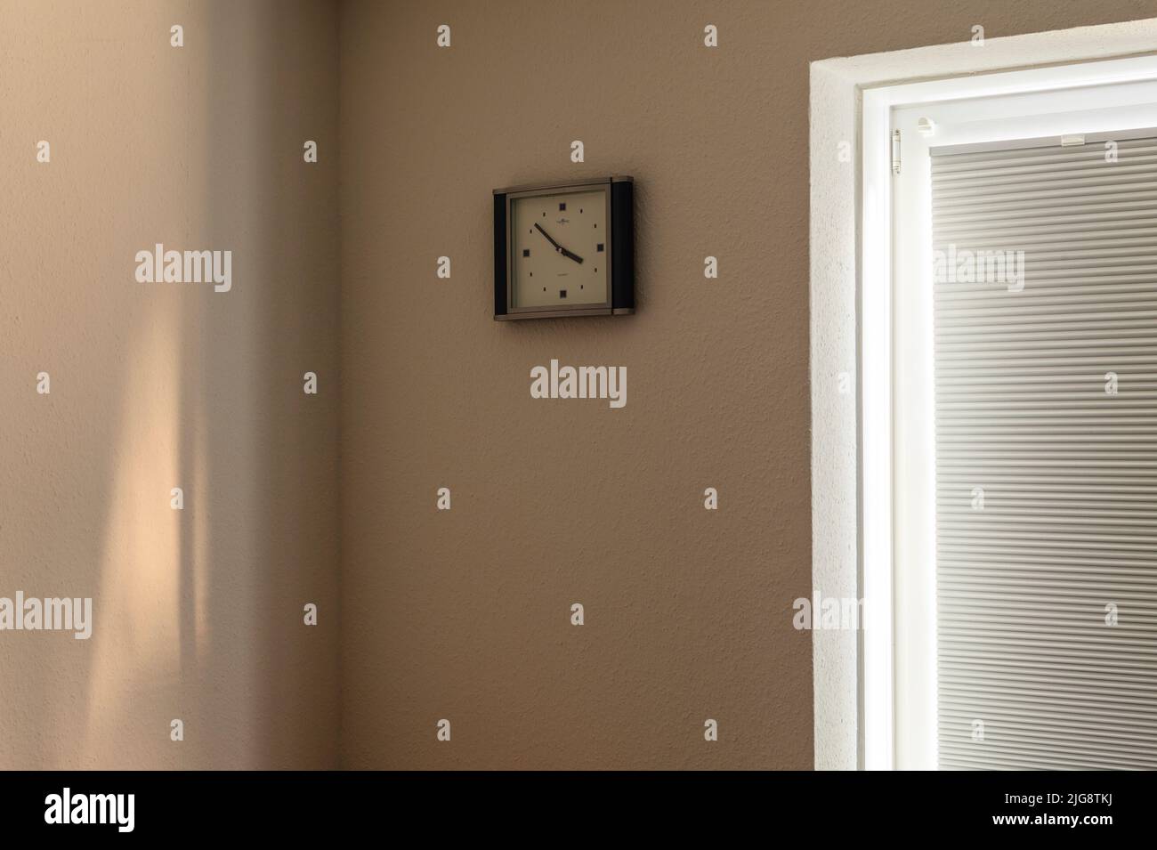 Wall clock in the room Stock Photo Alamy