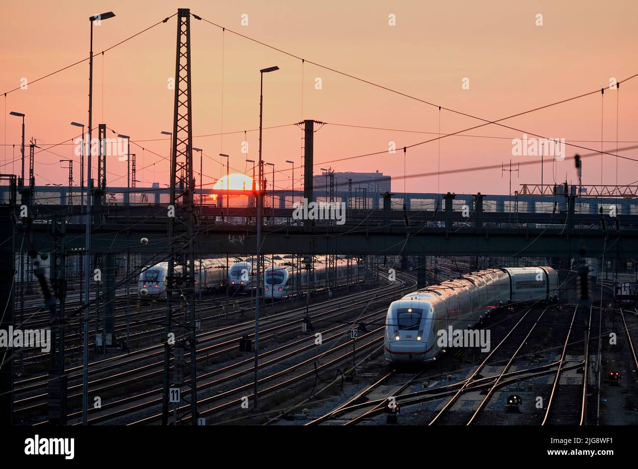 Germany, Bavaria, Munich, main station, Hackerbrücke, tracks, ICE, evening, sunset Stock Photo