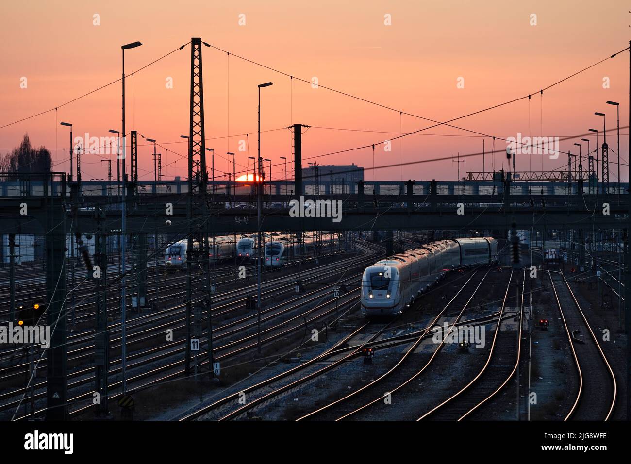 Germany, Bavaria, Munich, main station, Hackerbrücke, tracks, ICE, evening, sunset Stock Photo