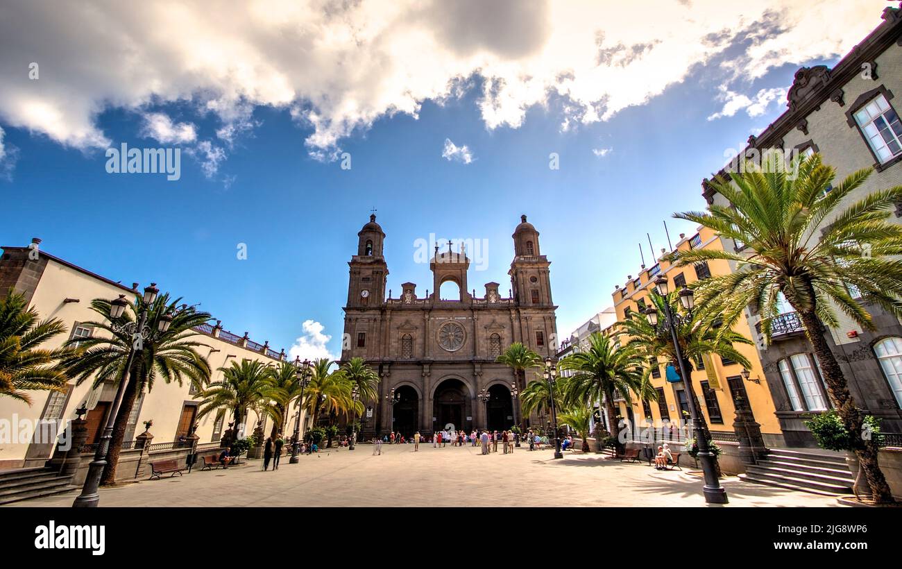 Spain, Canary Islands, Gran Canaria, Las Palmas, Old Town, La Vegueta, Santa Anna Cathedral, wide angle shot, HDR, Cathedral centered, Platia, blue sky with clouds, back light, palm trees Stock Photo