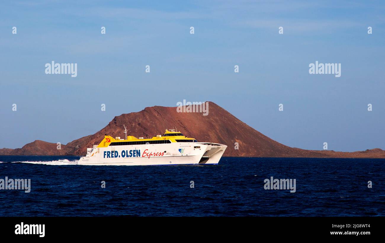 Spain, Canary Islands, Fuerteventura, Corralejo, Los Lobos Island, Fred Olsen ferry, catamaran ferry, sea dark blue, sky blue Stock Photo