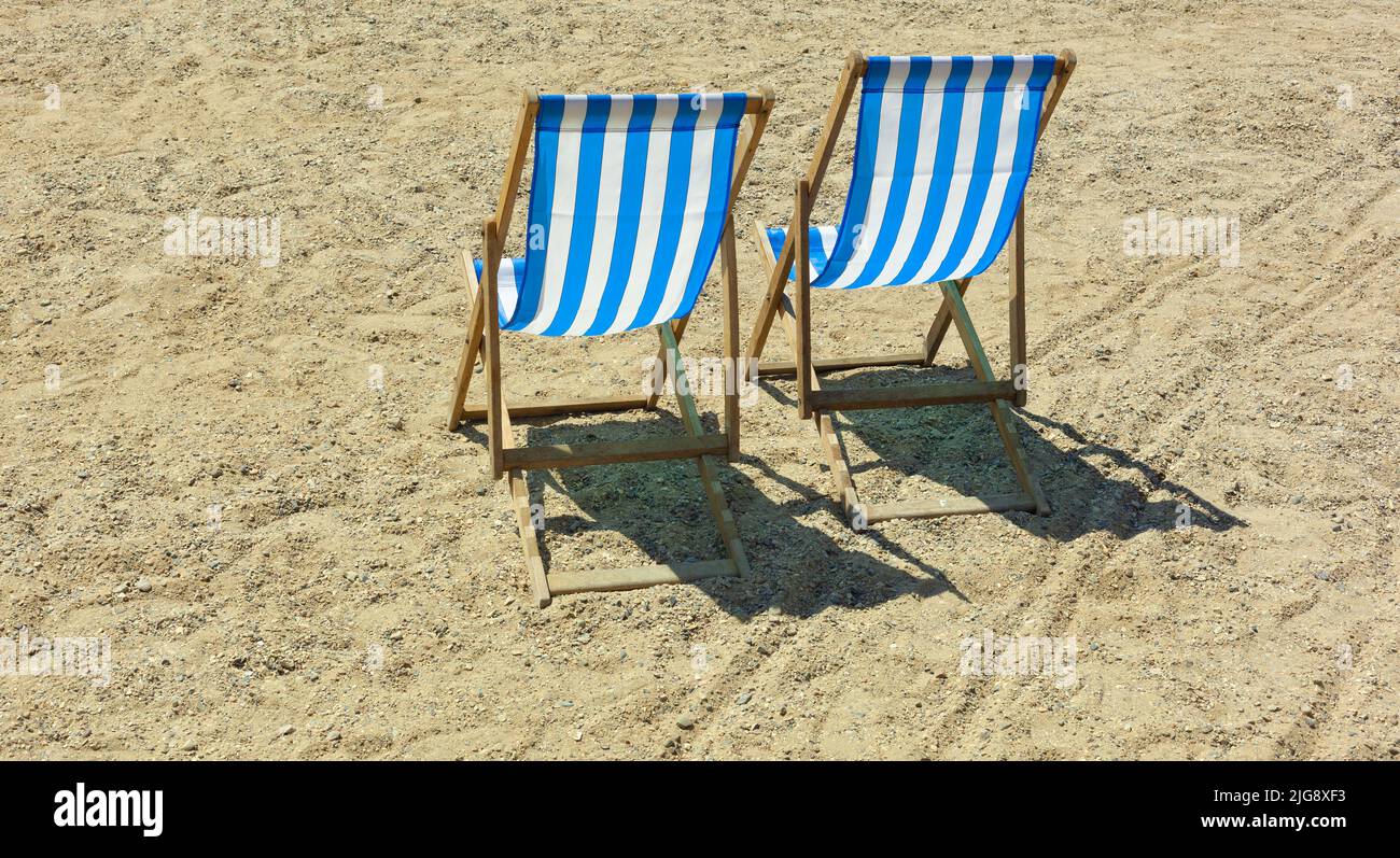 Two deckchairs on the beach, holiday/ vacation concept Stock Photo - Alamy