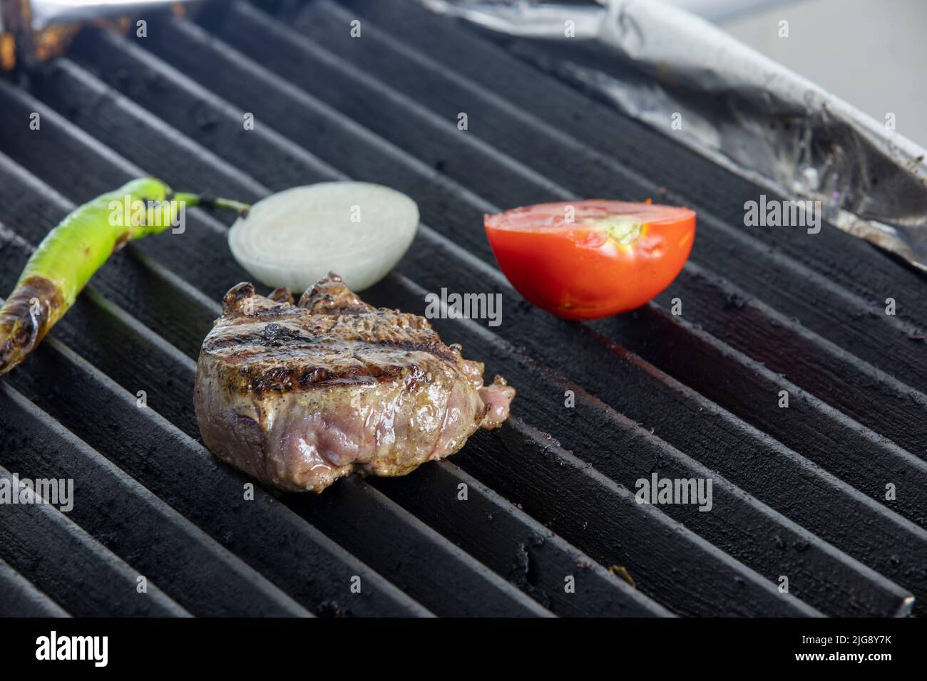 beef steaks on the grill Stock Photo