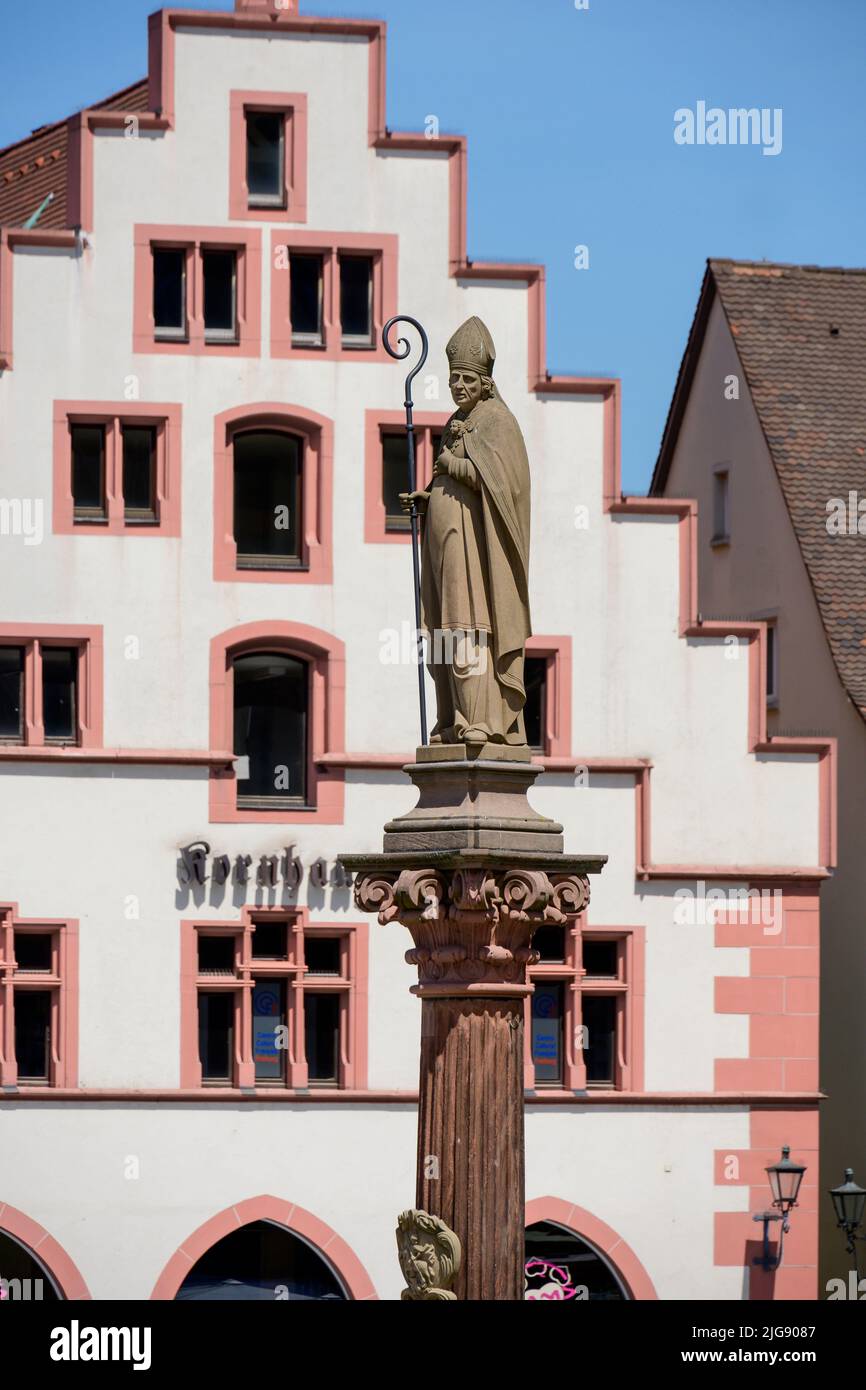 Germany, Baden-Württemberg, Black Forest, Freiburg, Münsterplatz, patron saint column with Bishop Lambert. Stock Photo