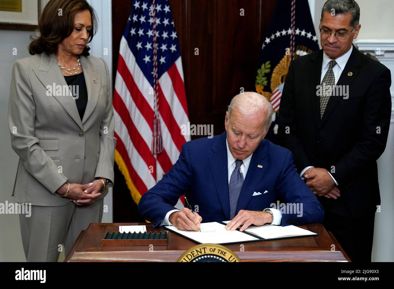 United States President Joe Biden with Vice President Kamala Harris and Health and Human Services Secretary Xavier Becerra signs the executive order on access to reproductive health care services in the Roosevelt Room at the White House in Washington on July 8, 2022. Credit: Yuri Gripas/Pool via CNP /MediaPunch Stock Photo