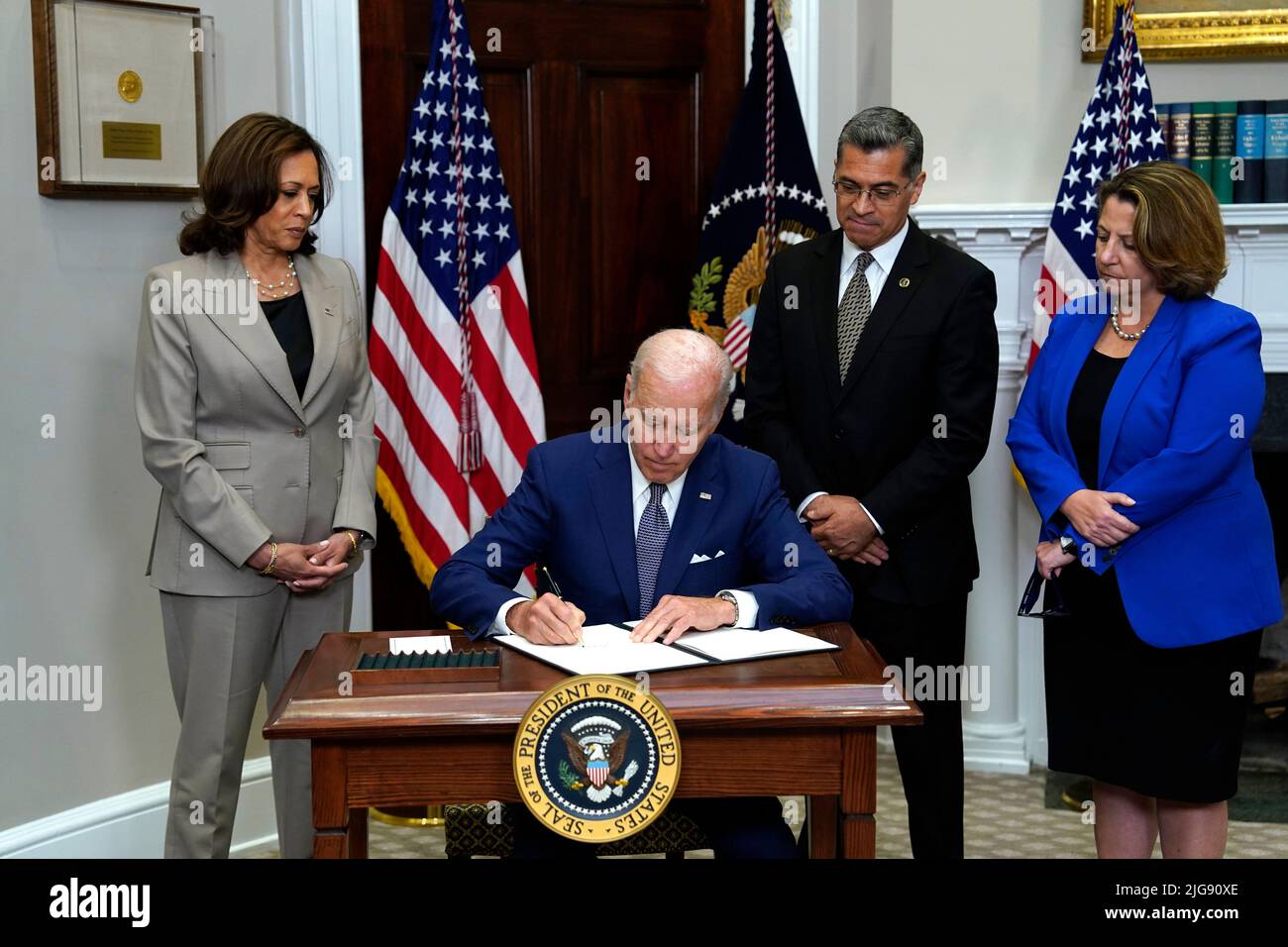 United States President Joe Biden signs the executive order on access to reproductive health care services in the Roosevelt Room at the White House in Washington on July 8, 2022. Behind the President are Vice President Kamala Harris, Health and Human Services Secretary Xavier Becerra and Deputy Attorney General Lisa Monaco. Credit: Yuri Gripas/Pool via CNP /MediaPunch Stock Photo