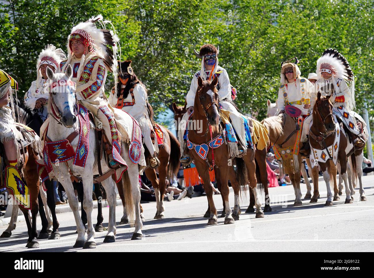 Members of the Tsuut'ina First Nation ride in the Stampede parade during the first day of the