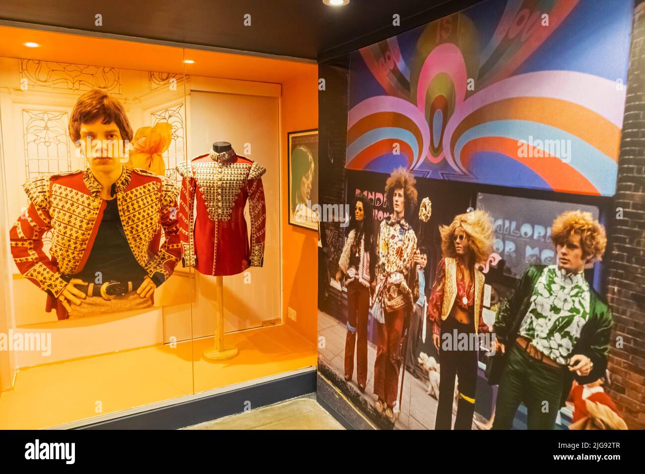 England, London, Southwark, Bermondsey, The Fashion and Textile Museum, Exhibit of 1960's Jacket worn by Mick Jagger of The Rolling Stones and Photograph of Group Wearing 1960's Fashion Stock Photo