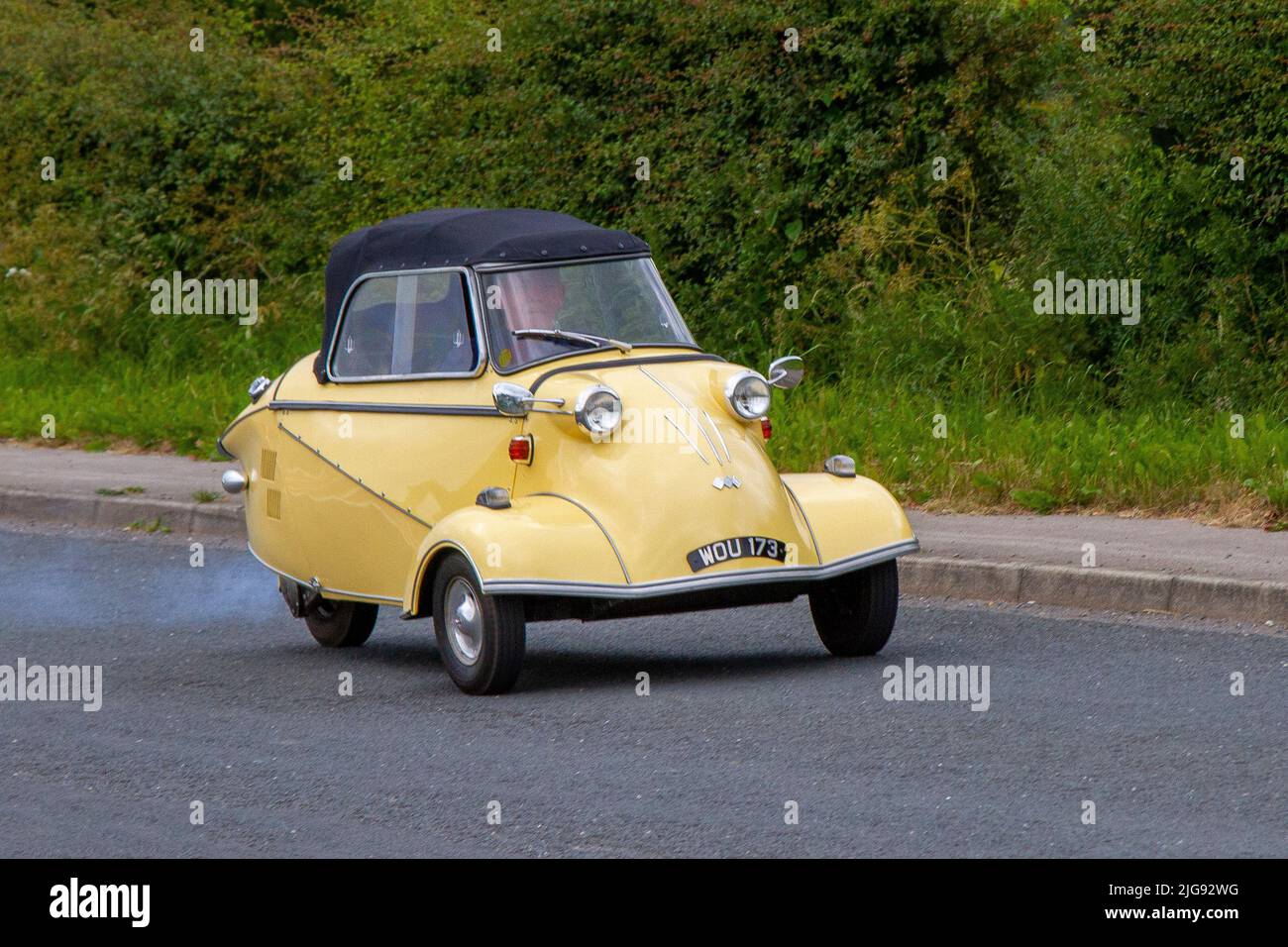 1959 50s fifties yellow Messerschmitt Bubble Car, KR200, or Kabinenroller (Cabin Scooter 191cc motorcycle en-route to Hoghton Tower for the Supercar Summer Showtime car meet which is organised by Great British Motor Shows in Preston, UK Stock Photo