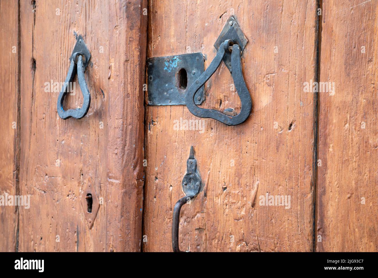 Vintage image of ancient door knocker on a wood Stock Photo