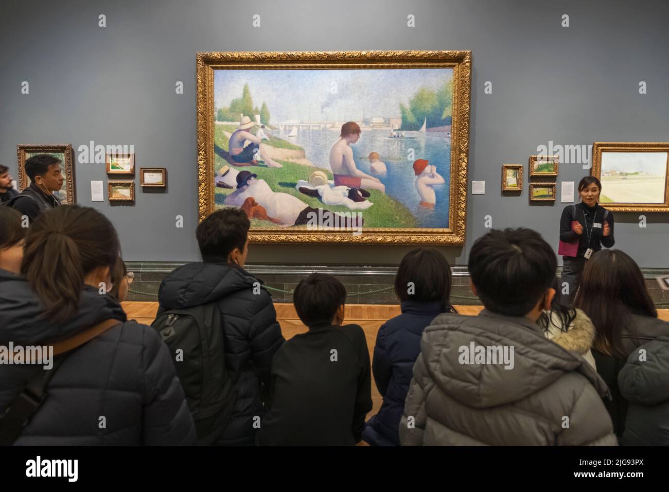 England, London, The National Gallery, Group of Asian School Children Looking at Artwork Stock Photo