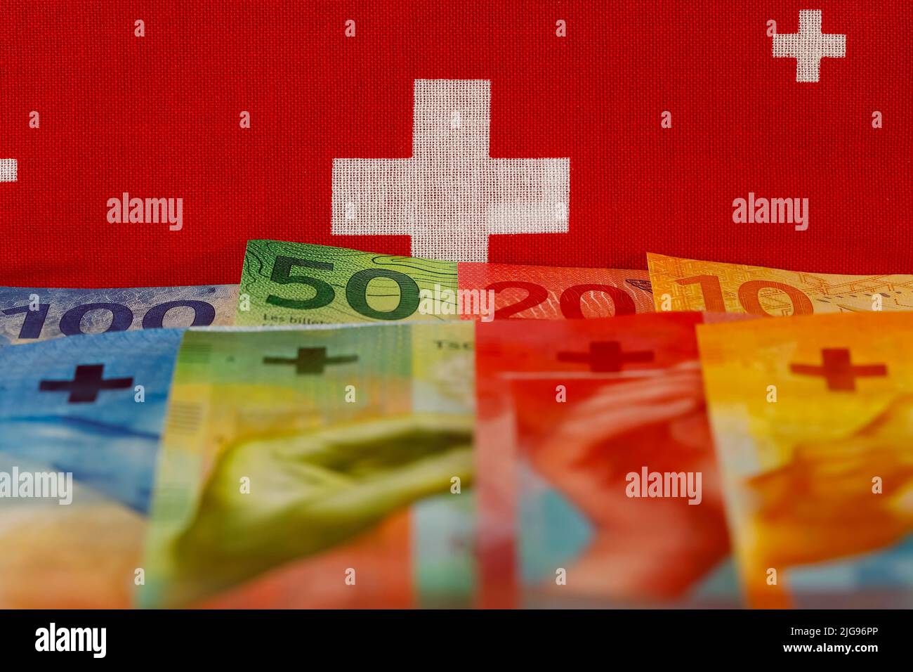 The new Swiss currency of various denominations is shown here with the symbol of the Swiss flag. These new banknotes are the eighth series of banknote Stock Photo