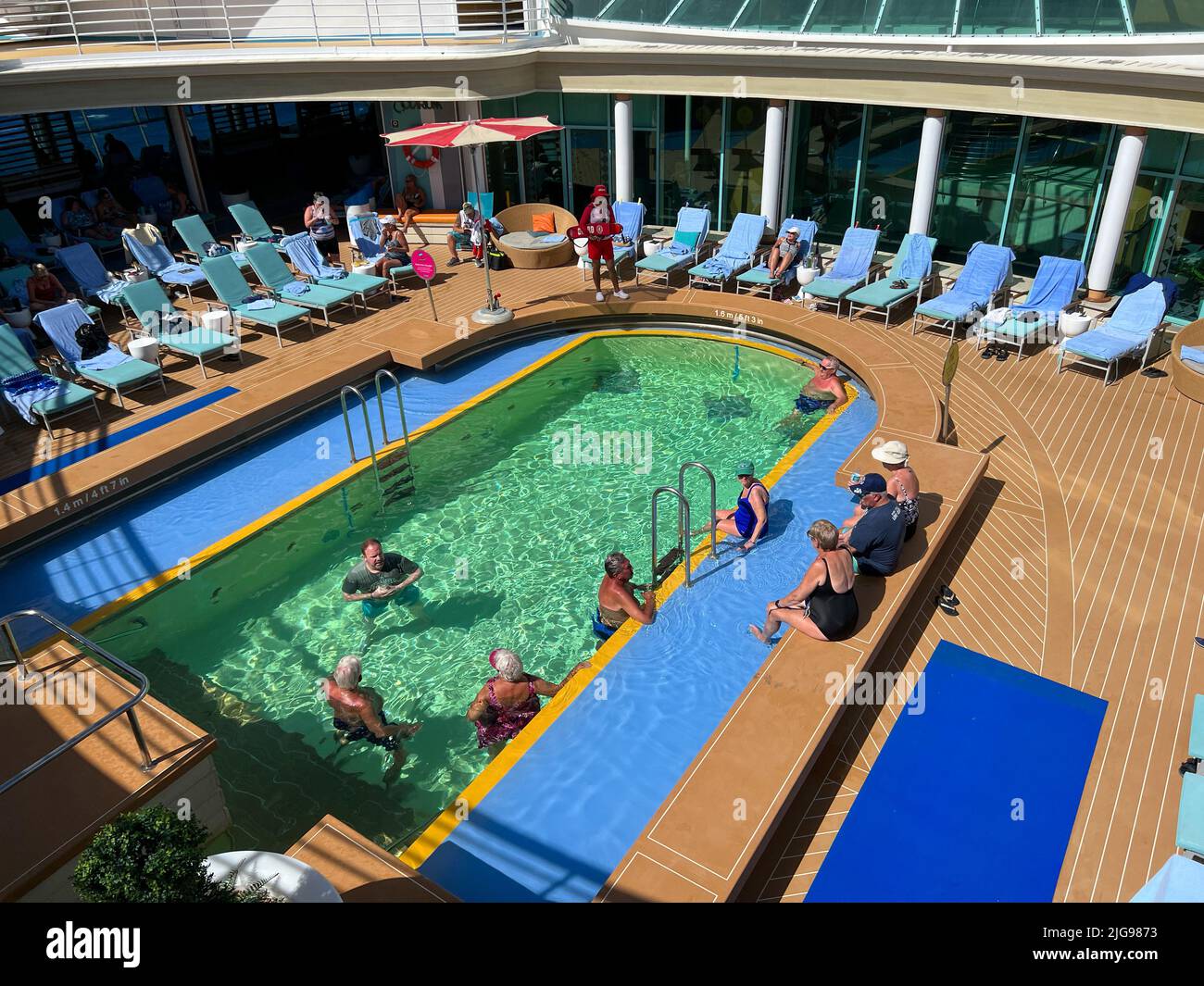 Orlando, FL USA - February 12, 2022:  The Solarium Swimming pool area aboard the Royal Caribbean Mariner of the Seas Cruise Ship. Stock Photo