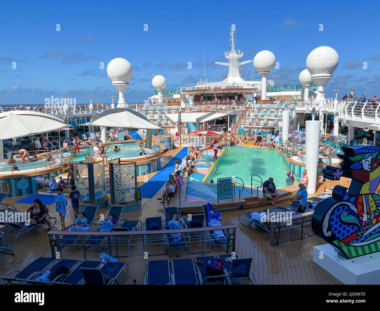 Orlando, FL USA - February 12, 2022:  The Swimming pool area aboard the Royal Caribbean Mariner of the Seas Cruise Ship. Stock Photo